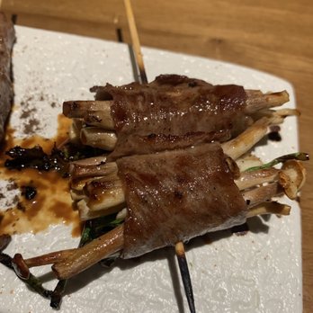 Shinya Shokudo - Wagyu Sukiyaki - enoki mushroom and Japanese mustard wrapped in American wagyu with tare sauce or truffle salt. Yummy! - Izakaya Near Me - Seattle, Washington Shinya Shokudo - Wagyu Sukiyaki - enoki mushroom and Japanese mustard wrapped in American wagyu with tare sauce or truffle salt. Yummy! - Izakaya Near Me - Seattle, Washington