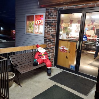 Top This Pizza - a person sitting on a bench - Pizza Near Me - Brewerton, New York