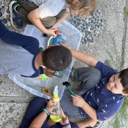 Tahoe Kiddos Private Daycare - Water play with pom-poms frozen in a large bowl of water