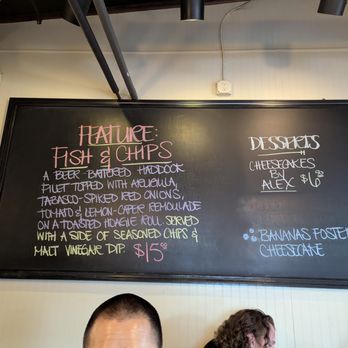 Hops Burger Bar - Blackboard specials menu, including desserts. This one featured fish and chips and cheesecake by Alex. - Burgers Near Me - Greensboro, North Carolina