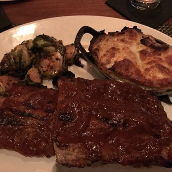 J Gilbert's - Wood-Grilled Ribs, Brussels Sprouts with Crispy Prosciutto, Poblano Au Gratin Potatoes - Seafood Near Me - Des Pers, Missouri J Gilbert's - Wood-Grilled Ribs, Brussels Sprouts with Crispy Prosciutto, Poblano Au Gratin Potatoes - Seafood Near Me - Des Pers, Missouri