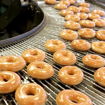 Krispy Kreme - glazed donuts on a conveyor belt - Donuts Near Me - Milledgeville, Georgia Krispy Kreme - glazed donuts on a conveyor belt - Donuts Near Me - Milledgeville, Georgia
