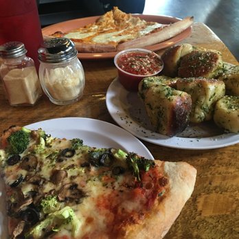 Ramunto's Pizza & Pub - slices + small order of the best garlic knots ever - Pizza Near Me - North Adams, Massachusetts