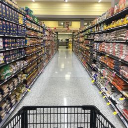 a shopping cart in the aisle a shopping cart in the aisle
