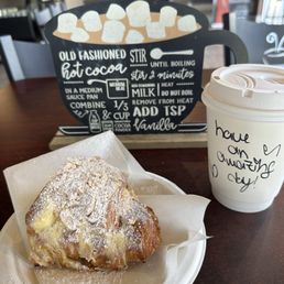 Vanilla latte with coconut milk and almond croissant with vanilla filling Vanilla latte with coconut milk and almond croissant with vanilla filling