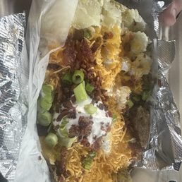 This is a huge baked potato with all the fixings . Yum !!!
