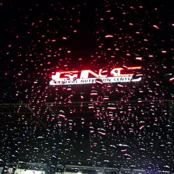 GNC - raindrops on a window of a store - Health Markets Near Me - Escondido, California