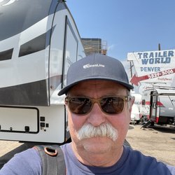 Trailer World of Colorado - 5th wheel over my right shoulder dealer sign over left