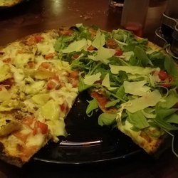 Vizieto - Half and half arugual and artichoke pizza. Parmesan slices on arugula side look and taste great