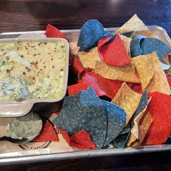 Circle 7 Ranch - Spinach, artichoke dip with tricolored corn chips. - Burgers Near Me - St. Louis, Missouri
