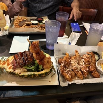 Pineapple Jacks Dunedin - PJ's Stuffed Pineapple (left) Coconut chicken tenders (right) - Tiki Bars Near Me - Dunedin, Florida Pineapple Jacks Dunedin - PJ's Stuffed Pineapple (left) Coconut chicken tenders (right) - Tiki Bars Near Me - Dunedin, Florida