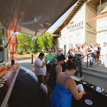 The Spot on Wheels - a group of people standing outside of a food truck - Food Trucks Near Me The Spot on Wheels - a group of people standing outside of a food truck - Food Trucks Near Me