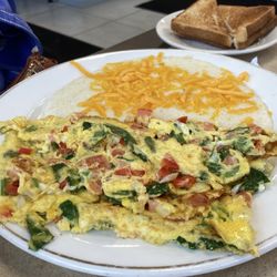 Garden omelette, creamy cheese grits (cheddar or American) toast.