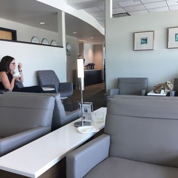 Delta Sky Club - two people sitting in the lounge area - Airport Lounges Near Me - Jacksonville, Florida Delta Sky Club - two people sitting in the lounge area - Airport Lounges Near Me - Jacksonville, Florida