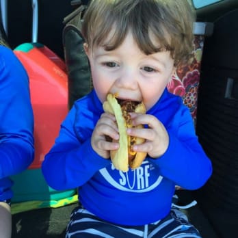 Depot Dogs - a little boy eating a banana - Food Trucks Near Me - Harwich, Massachusetts