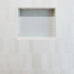 DFW Tile - Stacked Bedrosian shower wall tile with penny tile shampoo niche inlay!