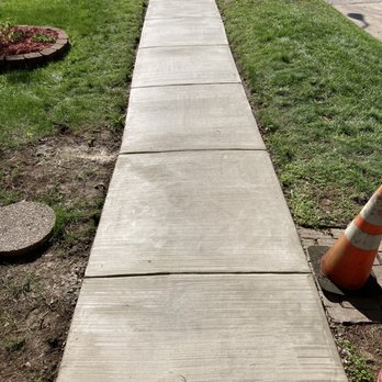 Ambassador Concrete LLC - a concrete sidewalk with traffic cones and a fire hydrant - Architects Near Me - Baltimore, Maryland