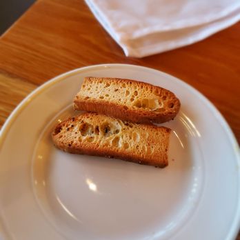 Industry Kitchen - Focacia bread served with seafood dish - American Near Me - New York, New York Industry Kitchen - Focacia bread served with seafood dish - American Near Me - New York, New York