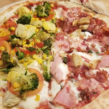 MOD Pizza - Brussels sprouts, roasted corn, broccoli, garlic and tomatoes vs. Canadian bacon, bacon, and tons of roasted garlic cloves. - Fast Food Near Me - Richmond, Virginia