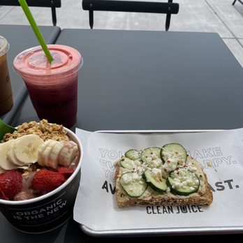 Clean Juice - Nutty Açaí bowl with "the energy one" juice and Hummus toast - Juice Bars & Smoothies Near Me - Colorado Springs, Colorado Clean Juice - Nutty Açaí bowl with "the energy one" juice and Hummus toast - Juice Bars & Smoothies Near Me - Colorado Springs, Colorado