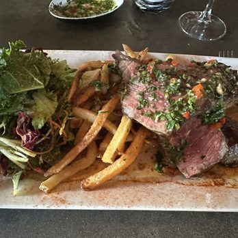 La Barrita Restobar - Bife de Chorizo (NY Strip) covered with bold chimichurri, served with addictive fries and fresh salad. YES. - Steakhouses Near Me - Baltimore, Maryland