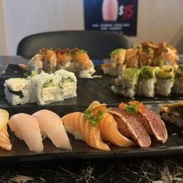 Salmon fantasy, can't remember the top right. Cali roll and super dragon roll. Lemon salmon, yellowtail, garlic salmon, pepper tuna, unagi Salmon fantasy, can't remember the top right. Cali roll and super dragon roll. Lemon salmon, yellowtail, garlic salmon, pepper tuna, unagi