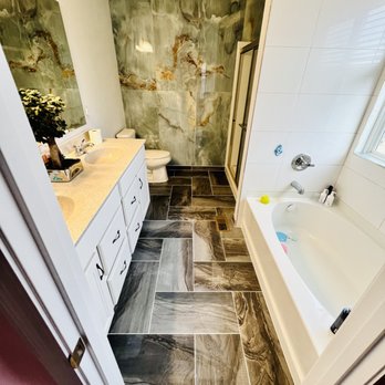 Euro Services - a bathroom with tile flooring - General Contractors Near Me