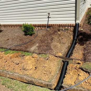 Pablo’s Landscape - a drainage system being installed in front of a house - Landscaping Near Me Pablo’s Landscape - a drainage system being installed in front of a house - Landscaping Near Me