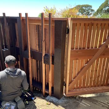 Perfect Landscaping Services - Painting newly built fence & gate - Landscaping Near Me