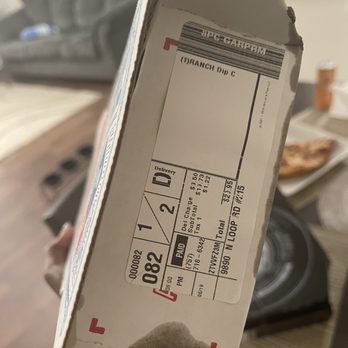 Domino's Pizza - a hand holding a pizza box - Pizza Near Me - Pensacola, Florida Domino's Pizza - a hand holding a pizza box - Pizza Near Me - Pensacola, Florida