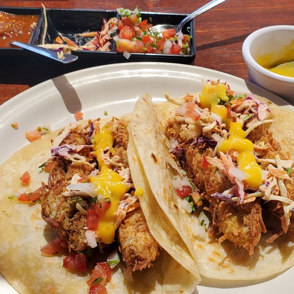 Omega - Coconut Crusted Fish Tacos all dressed up including a Mango sauce. - Mexican Near Me - Cabo San Lucas, BCS