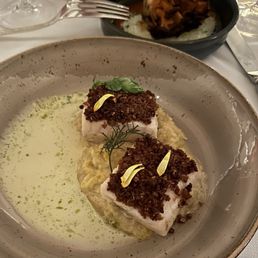 BUTTER POACHED STURGEON Chicken Skin Crumble, Preserved Cabbage. Smoked Buttermilk Nage w/Roasted Maitake Mushroom