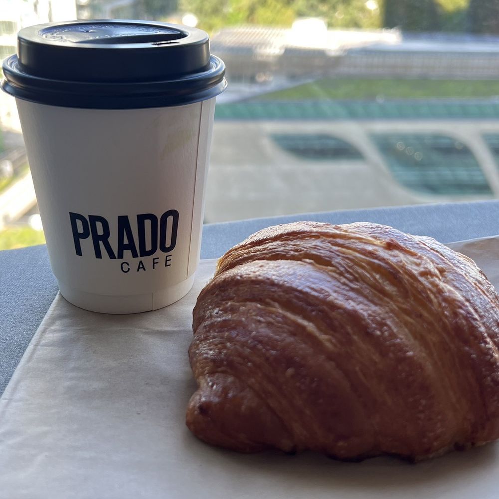 a croissant and a cup of coffee a croissant and a cup of coffee