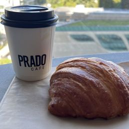 a croissant and a cup of coffee a croissant and a cup of coffee