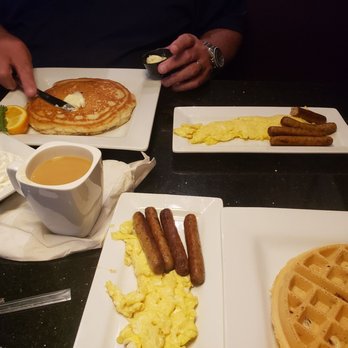 Keke's Breakfast Cafe - Pecan waffle with scrambled eggs and sausage links. Also pancake with scrambled eggs and sausages. - Breakfast & Brunch Near Me - St. Augustine, Florida