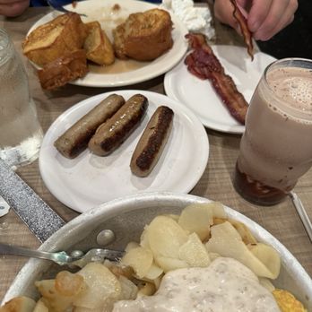 Lou Mitchell's - Grilled Thick French Toast, Sausage, Crisp Bacon, Chicken Sausage Omelette with Sausage Gravy and Swiss cheese. Homefries. - Breakfast & Brunch Near Me - Chicago, Illinois