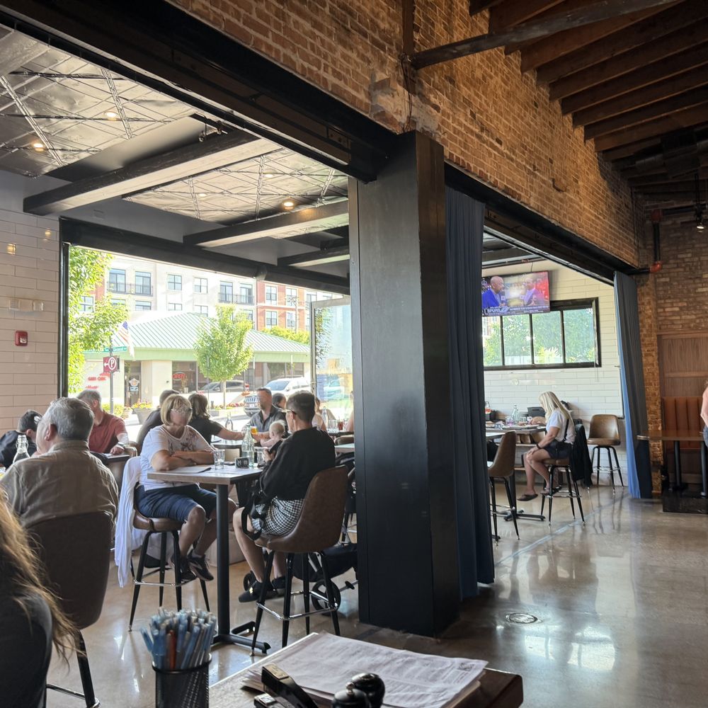 Maplewood Public House - View of nice patio like seating by their open front windows. - Breweries Near Me - Glen Ellyn, Illinois