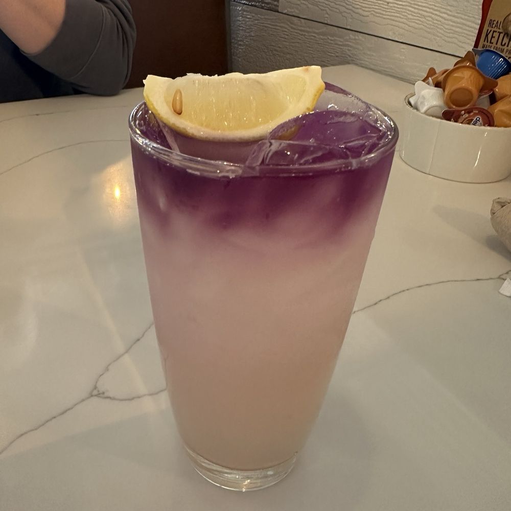 First Watch - Purple haze mocktail before stirring - Breakfast & Brunch Near Me - Alexandria, Virginia First Watch - Purple haze mocktail before stirring - Breakfast & Brunch Near Me - Alexandria, Virginia