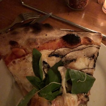 Lucali - Up close of mushroom, basil, garlic and shallots. - Pizza Near Me - Brooklyn, New York Lucali - Up close of mushroom, basil, garlic and shallots. - Pizza Near Me - Brooklyn, New York