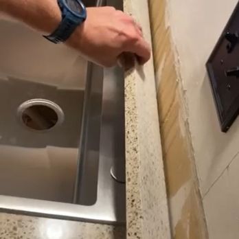 Stone Systems - No silicone/caulk/NOTHING holding backsplash in place.  Piece was just propped against the drywall. - Countertop Installation Near Me - Raleigh, North Carolina
