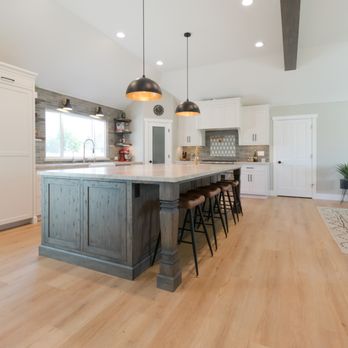 Silva Custom Construction - a large kitchen with a center island - General Contractors Near Me