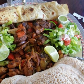 Jubba - Tasty chicken and goat with side of chapati, ingera and salad. - African Near Me - San Jose, California Jubba - Tasty chicken and goat with side of chapati, ingera and salad. - African Near Me - San Jose, California