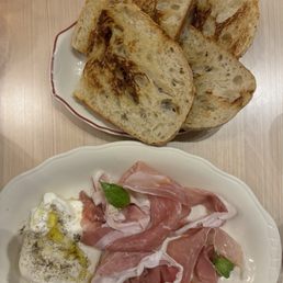 Burrata and prosciutto with sourdough Burrata and prosciutto with sourdough