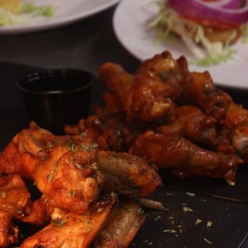 Hillsmere Restaurant and Bar - a plate of chicken wings and a plate of salad - Bars Near Me - Baltimore, Maryland Hillsmere Restaurant and Bar - a plate of chicken wings and a plate of salad - Bars Near Me - Baltimore, Maryland