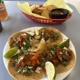 Tacos de asada and al pastor Tacos de asada and al pastor
