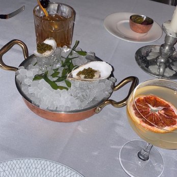 Maple & Ash - Raw oyster with caviar and chilled vodka chaser - Steakhouses Near Me - Chicago, Illinois