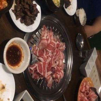 Koba Korean Bbq - On the stove(uncooked) brisket, on the plate (cooked) bulgogi - Korean Near Me - Baltimore, Maryland Koba Korean Bbq - On the stove(uncooked) brisket, on the plate (cooked) bulgogi - Korean Near Me - Baltimore, Maryland