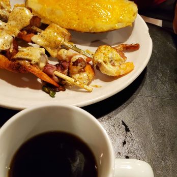 Ribeyes - a plate of food and a cup of coffee - Steakhouses Near Me - Cornelia, Georgia
