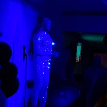 The Drink - a woman standing in a blue room - Coffee & Tea Near Me - Toronto, Ontario