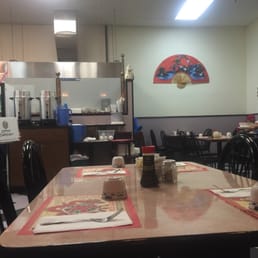 a dining room with tables and chairs a dining room with tables and chairs